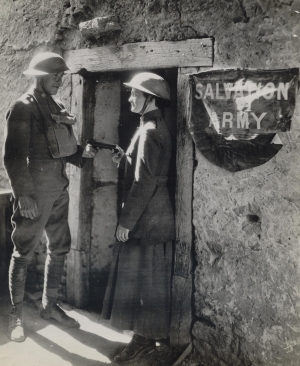 Helen Purviance and an American soldier pose outside a Salvation Army dugout near the Western Front, circa 1918.
