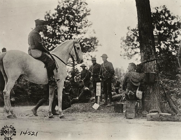 US officer inspecting telephone switchboard wwimus