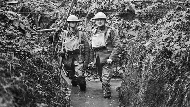 soldiers in flooded trench