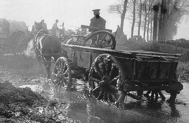a soldier drives a horse and supply cart through water logged fields and roads pic dm 440860274