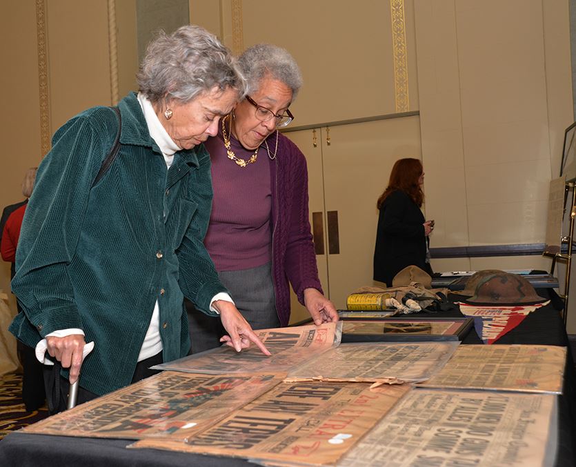 two female guests reveiwing san fran display april 6