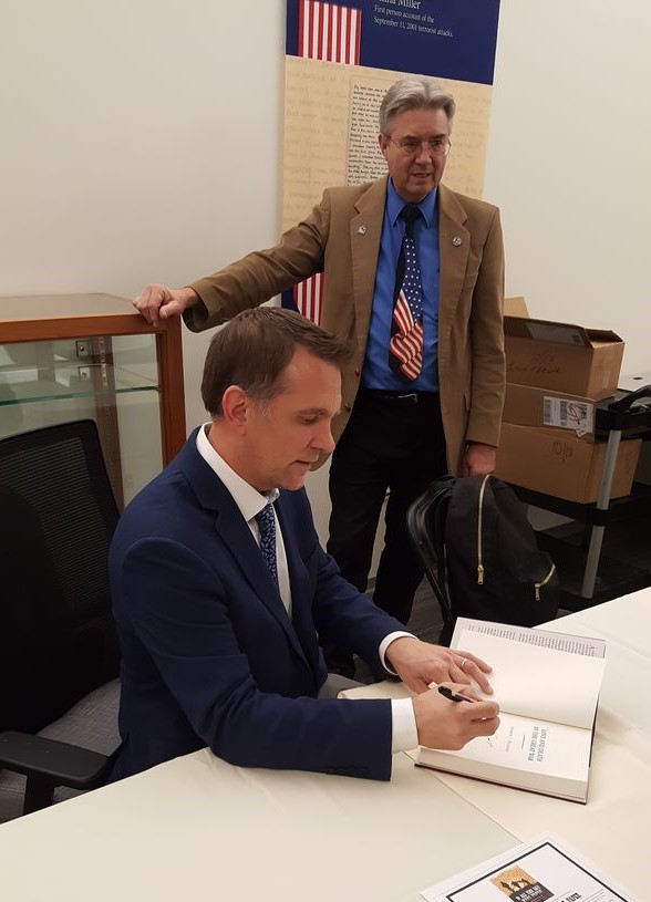 13 dr huebner signs book for co director bill betten result