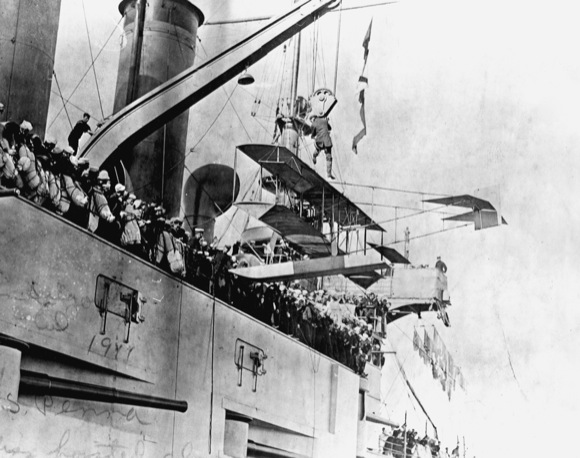 curtiss seaplane being taken aboard