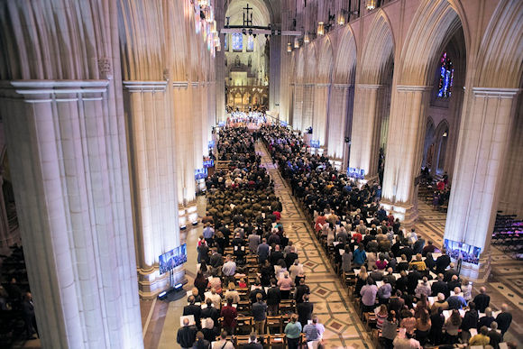 Overhead shot of the cathedral pews full of people