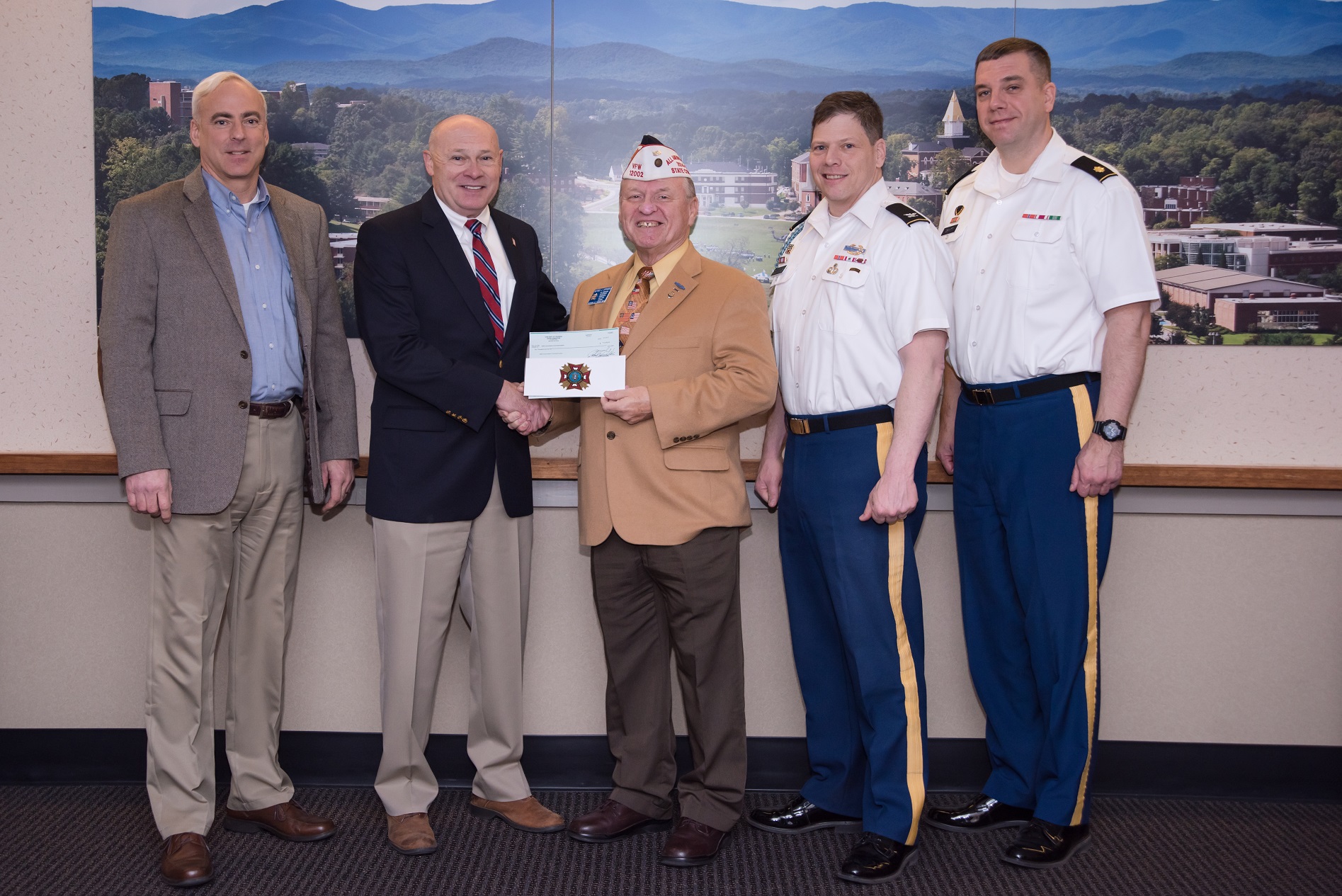 Al Lipphardt, former state commander of the VFW Department of Georgia, (center) presenting a $10,000 donation Feb. 3 to Dr. Billy Wells, senior vice president for leadership and global engagement at the University of North Georgia and chairman of the GWWICC (second from left). Also pictured are (left to right) Keith Antonia, associate vice president for military programs at UNG; Army Col. Gery Cummings, professor of military science; and Army Maj. Steven Devitt, executive officer of UNG’s Department of Military Science.