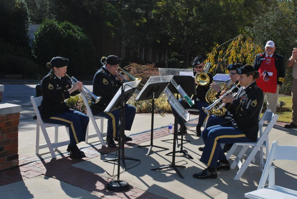 DSC 5 person military band performs in a circle.