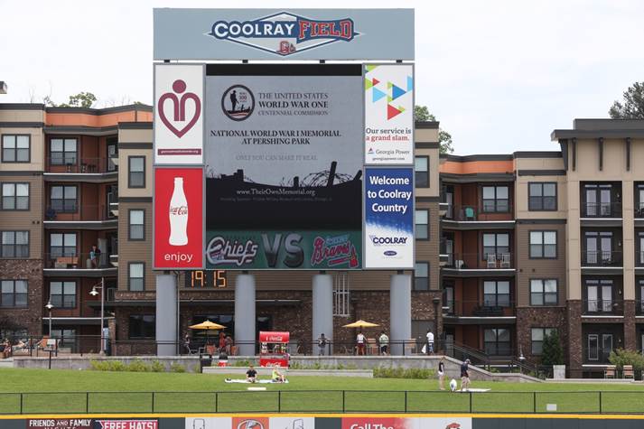 Photograph of CoolRay Field's giant screen showing the Georgia World War 1 Memorial at Pershing park