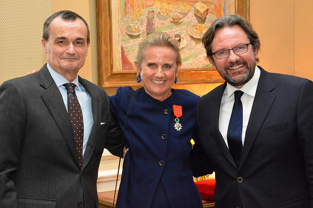 Commissioner Monique Seefried takes a photo with Ambassador Gérard Araud
