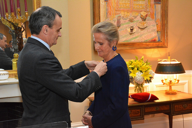 France's Ambassador to the United States, Gérard Araud, pins The Legion d'Honneur onto U.S. World War I Centennial Commissioner Monique Seefried 