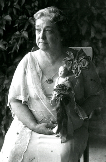 Moina Michael poses with the Poppy Lady Doll, a replica of her, that won a national doll competition held by the Federation Woman's Club in 1932. Michael retired from UGA in 1938 after having worked in education for 54 years.