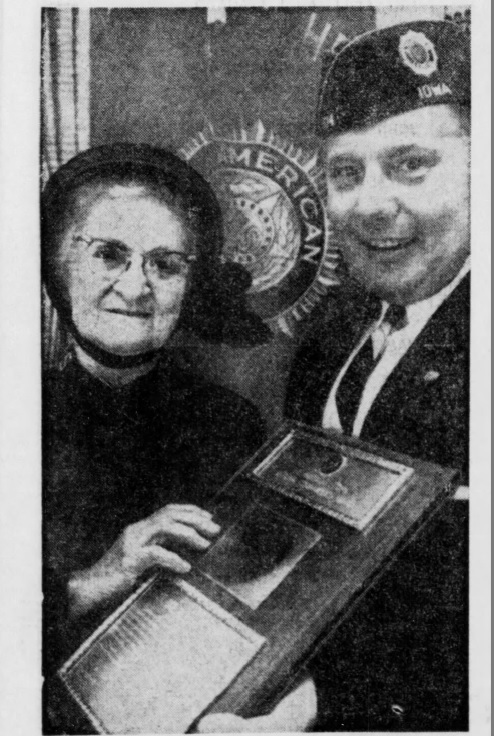 Helen Purviance receives a plaque from the American Legion National Commander Donald Johnson in honor of her humanitarian service on October 21, 1964.