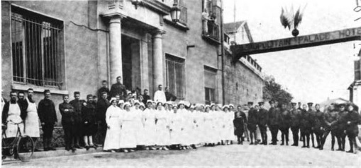 Personnel of Hospital A pose for a photograph outside of their hospital, housed in the Cosmopolitan Palace Hotel in Contrexeville, France.