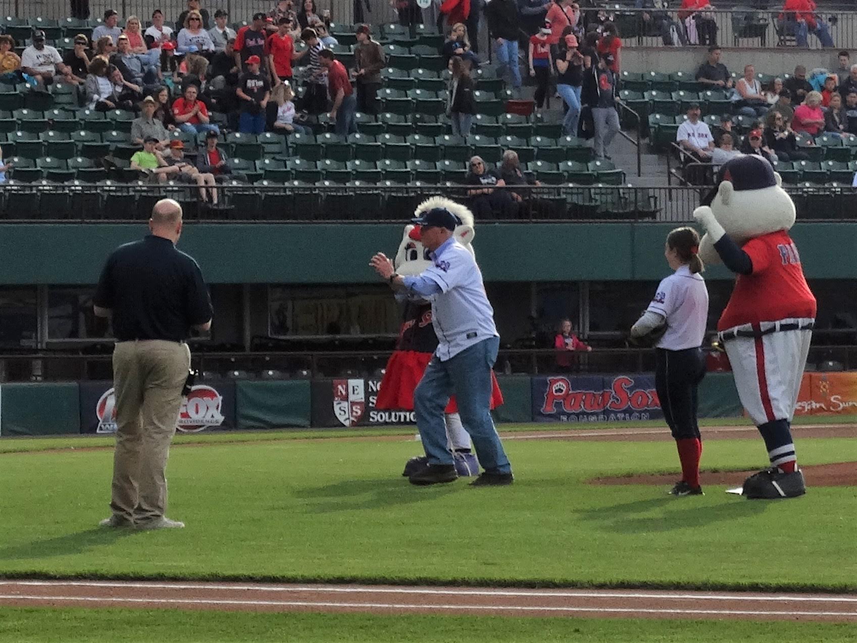 WW1CC volunteer Nat Sims, descendent of famed World War I Admiral William Sims, throws out the first pitch at the Pawtucket game.