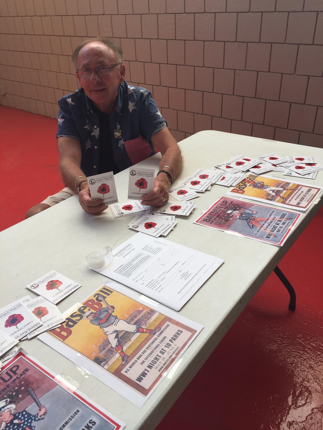 WW1CC volunteer Rich hands out Poppy Seed Packets at the Buffalo Bisons game