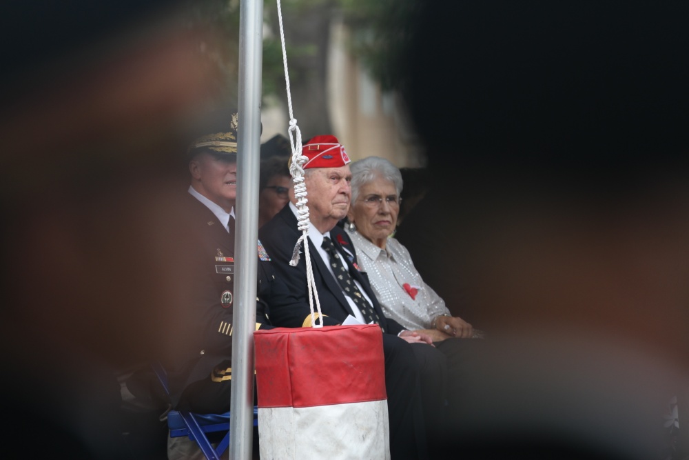 Retired Master Sgt. Vernon Schmidt (left), a 91 year old surviving member of the 90th Infantry Division’s from WWII, sits alongside his wife during the Fort Sam Houston’s WWI Centennial Ceremony honoring the 90th ID inside the historic Quadrangle at Fort Sam Houston, Texas. “This is exciting and a real honor for me to represent my division,” said Schmidt. (Photo by Staff Sgt. Tomora Nance, U.S. Army North Public Affairs)