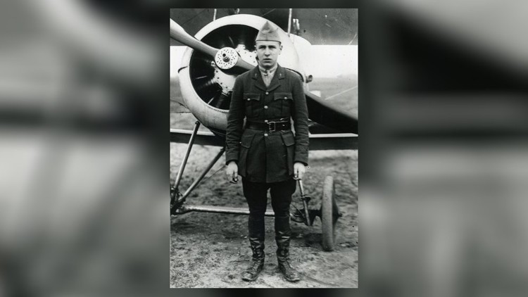 Tommy Hitchcock in front of plane