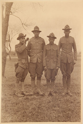 Left to right: Anton Mentag, Stacy SittingHawk, Owen Yakeyonney, and Hezekiah Chebetah. Camp Mills, March 31, 1919. Courtesy of Mathers Museum of World Cultures.