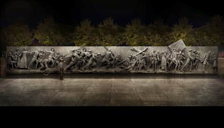 The memorial wall sculpture at night
