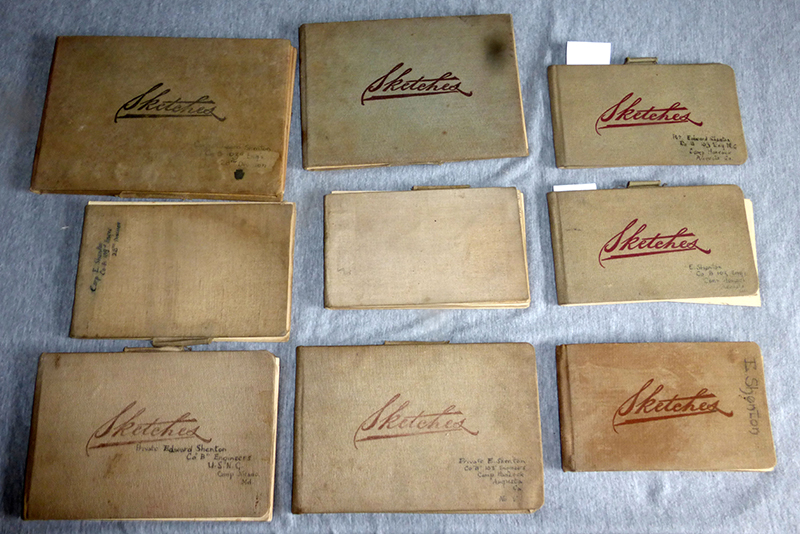 Nine canvas-bound sketchbooks with "Sketches" emblazoned on the covers in red handwriting