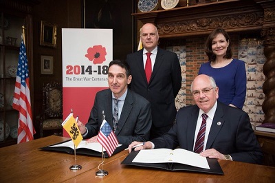 Koen Verlaeckt (left), Secretary General of the Flanders Department of Foreign Affairs, and Daniel Dayton, Executive Director of the U.S. World War 1 Centennial Commission, sign the agreement.