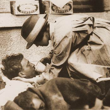 An American Red Cross angel provides comfort to a wounded man