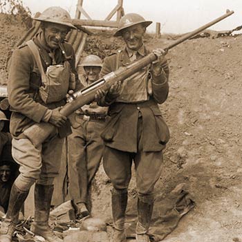 British soldier grin at their captured 1918 Mauser Tankgewehr anti-tank gun