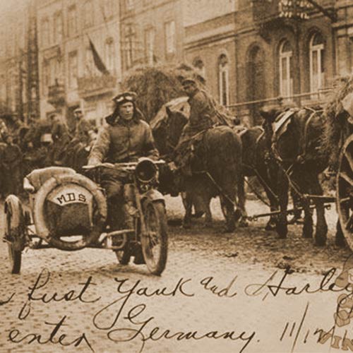 The first American who set foot on German soil 11/12/18, the day after the Armistice was corporal Roy Holtz, US Army entering Germany riding a Harley-Davidson motorcycle and sidecar.
